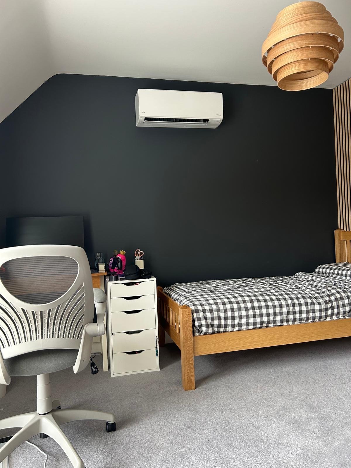 Working at a desk with air conditioning above