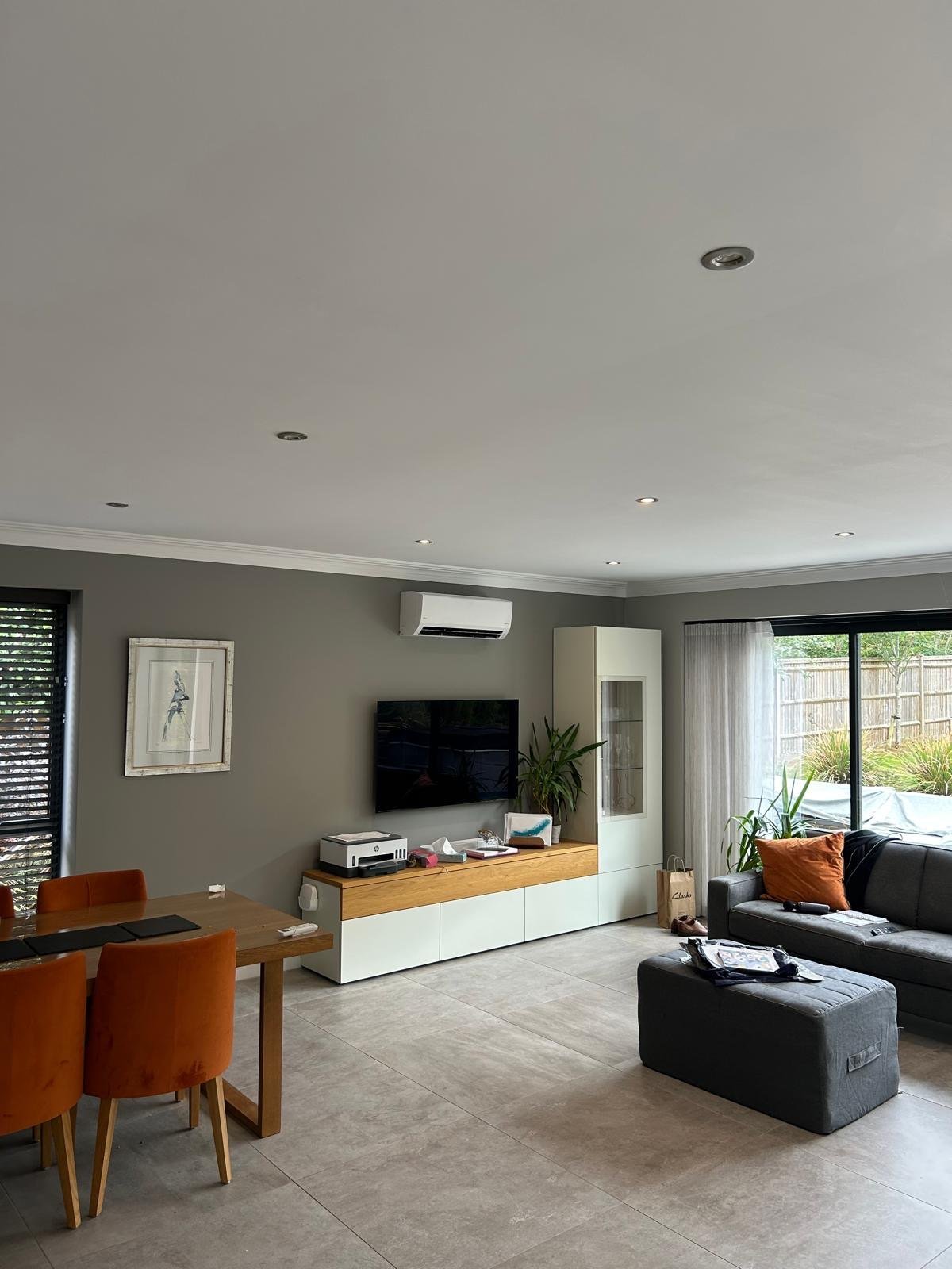 Wall-mounted air conditioning in a modern open-plan living room